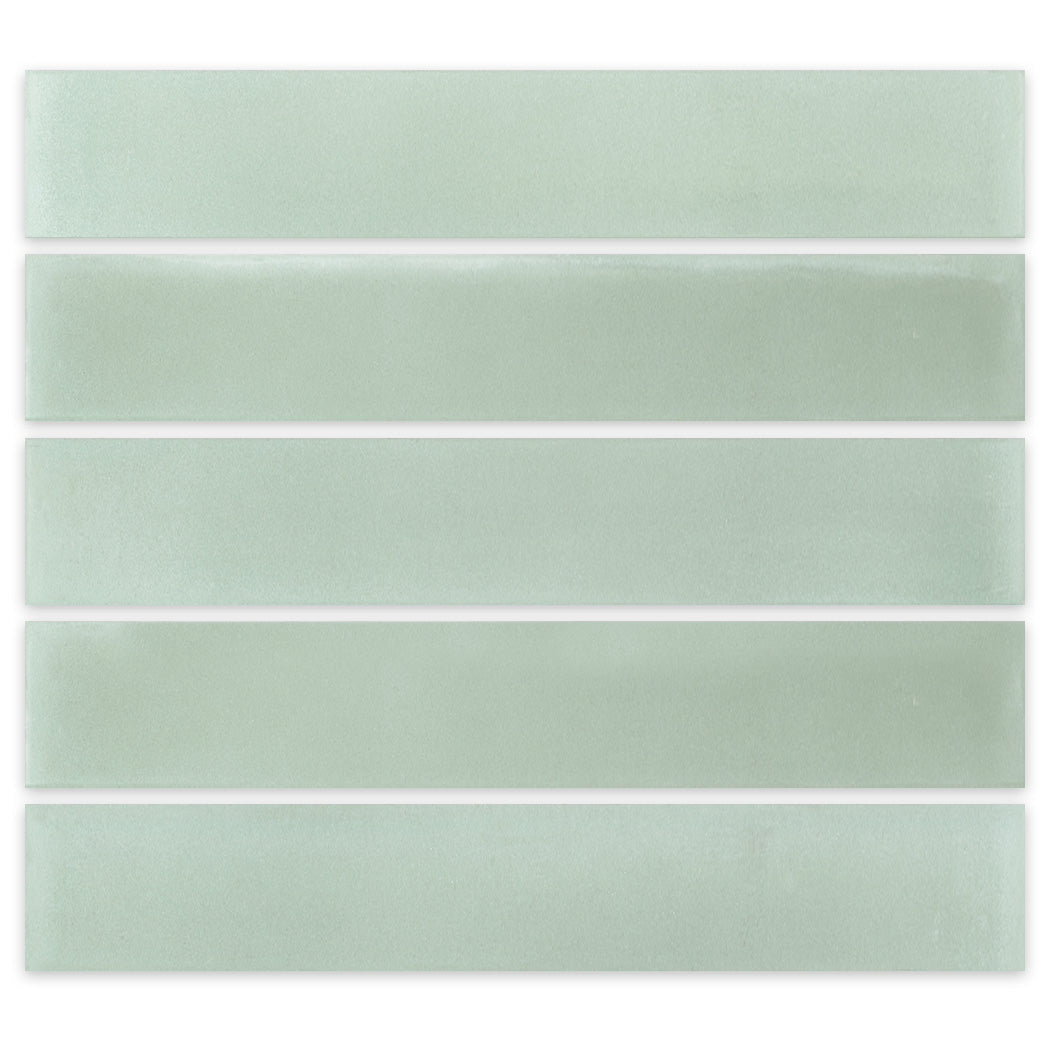 Five 2x12 Solid Pale Jade tiles by New York Cement Tile arranged in parallel rows on a white background.