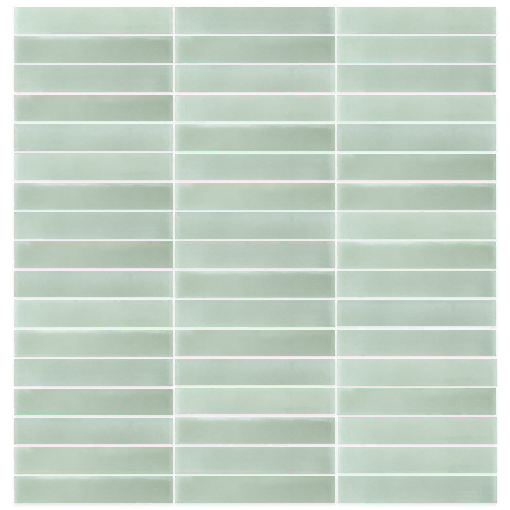 2X12-Solid Pale Jade tiles by New York Cement Tile in light green, laid in rows with white grout lines.