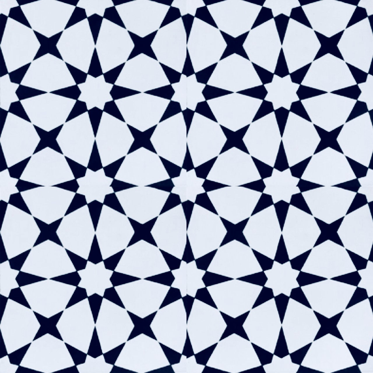 The N20-271 Extra Sample by New York Cement Tile features a black and white star geometric pattern on durable cement tiles.