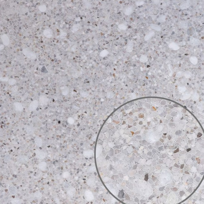 The TERRAZZO 24X24- Pompano Sample by New York Cement Tile features a white and grey speckled, mosaic-like circle design.