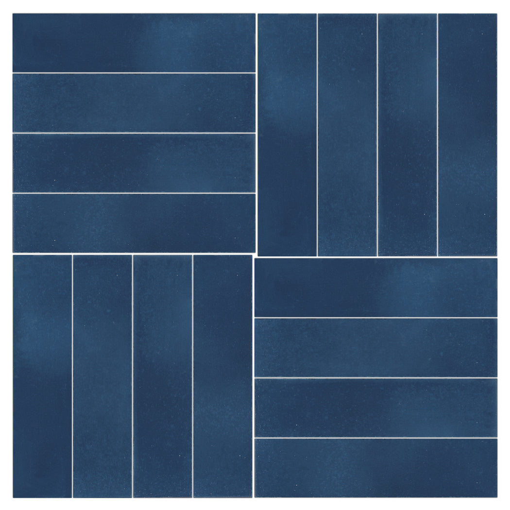 Four sections of 2x8 Solid Nautical Depth by New York Cement Tile create a durable backsplash with striking white grout.