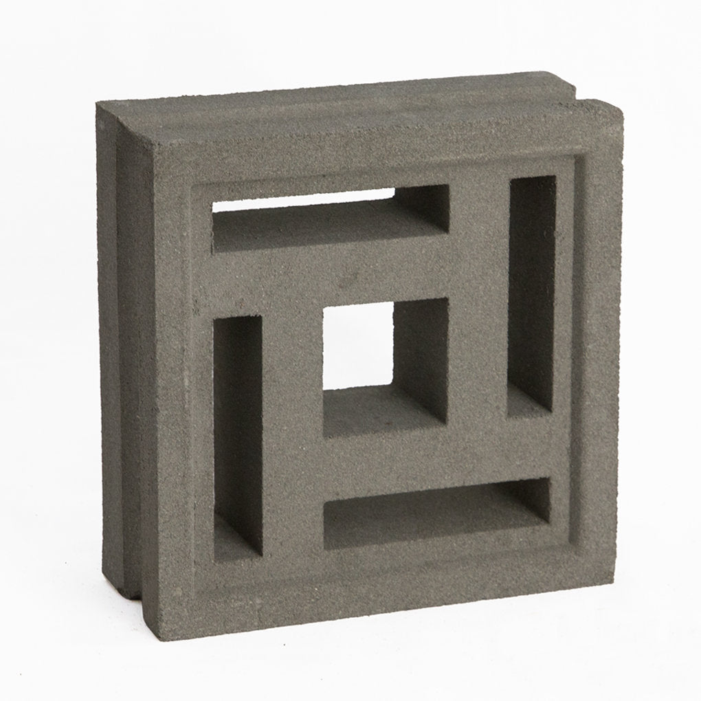The Carabado Sample by New York Cement Tile is a square breeze block with geometric cut-outs, ideal for privacy screens.