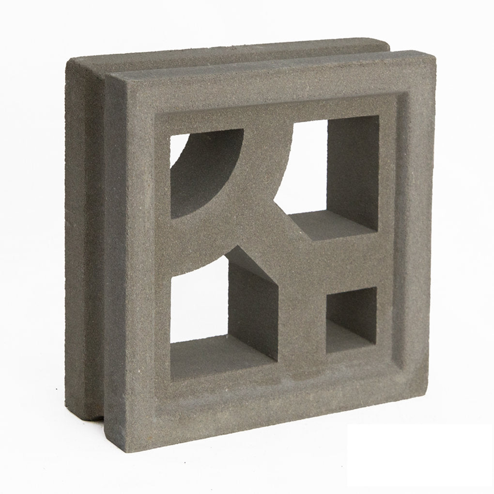 The Caprina by New York Cement Tile is a gray breeze block with geometric cutouts for mid-century modern style.
