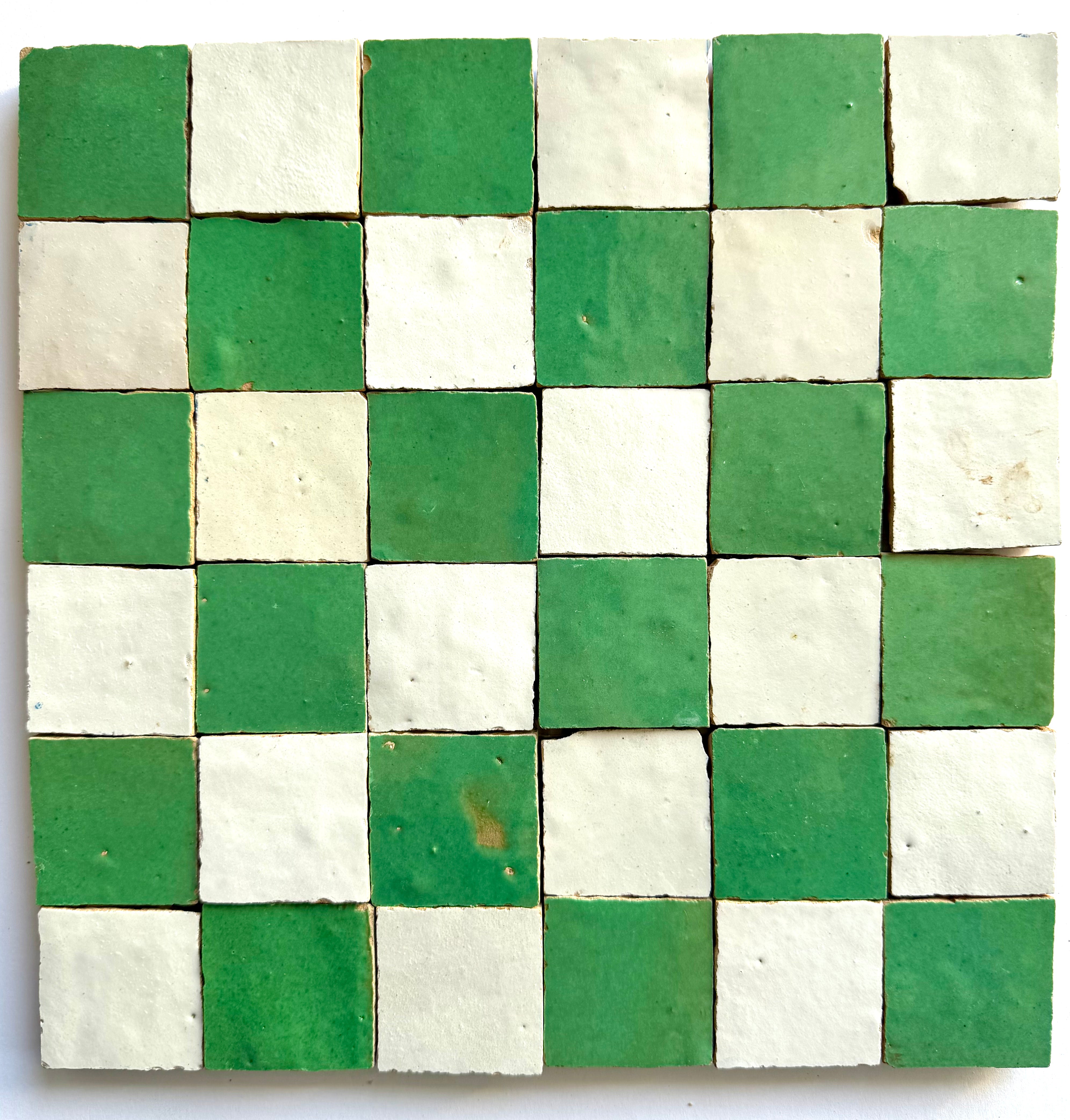 The 2X2 Checkerboard Zellige in Ivory Cloud and Green by New York Cement Tile features small square ceramic tiles.