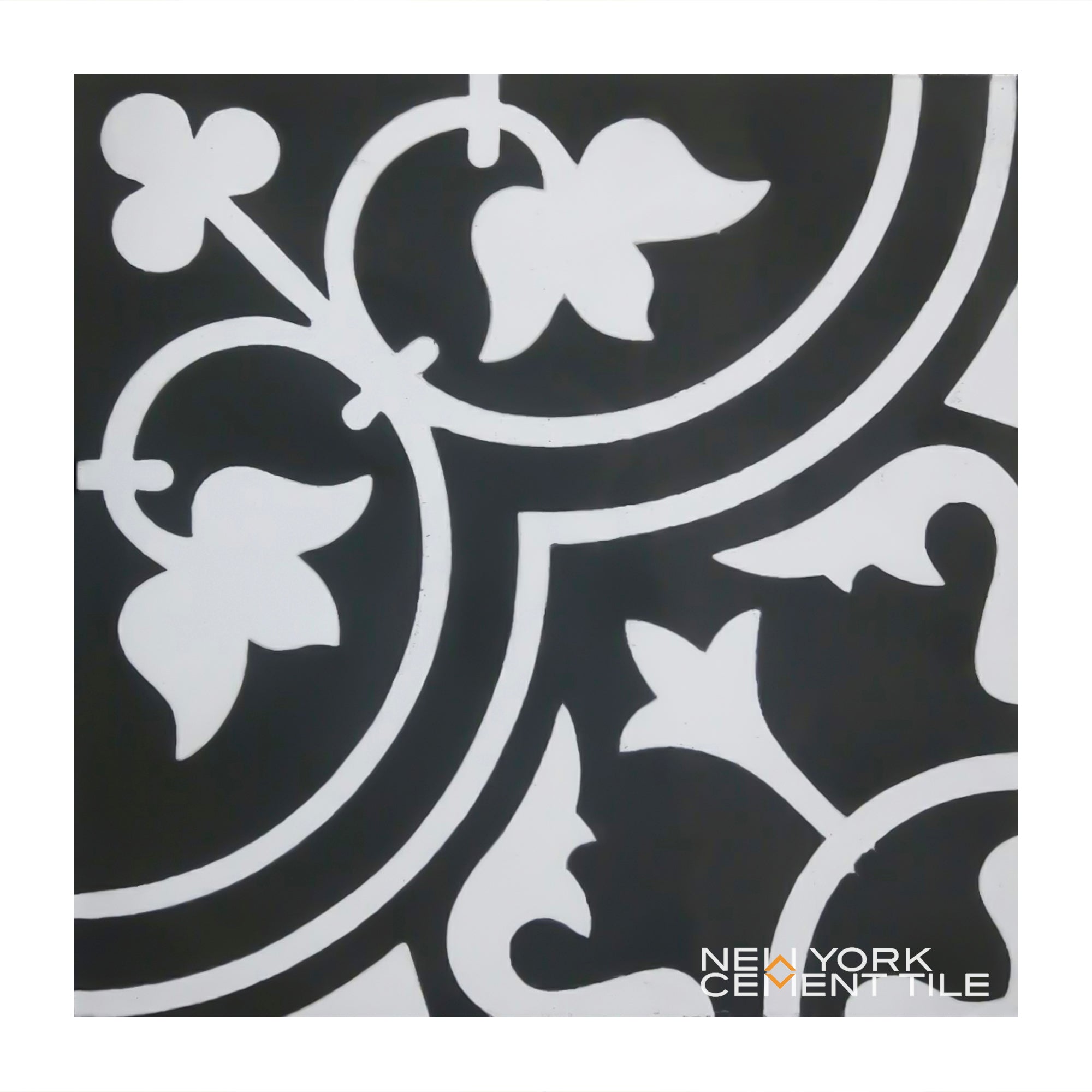 N20-172 Sample: Black and white cement tile with bold, curving lines, leaf motifs; New York Cement Tile logo in corner.