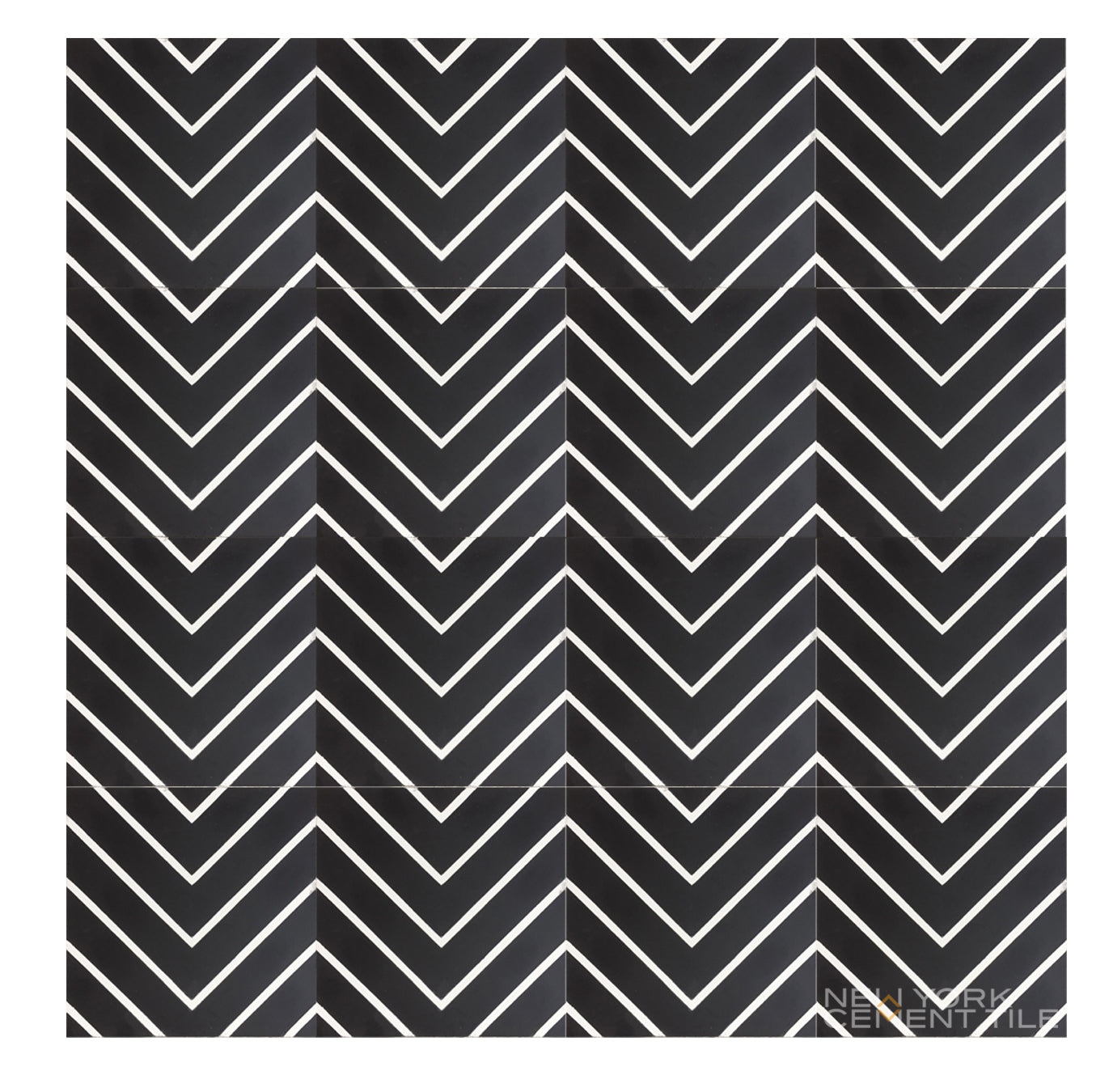 N20-437 by New York Cement Tile: black cement tiles with white chevrons create a bold, durable zigzag statement floor.