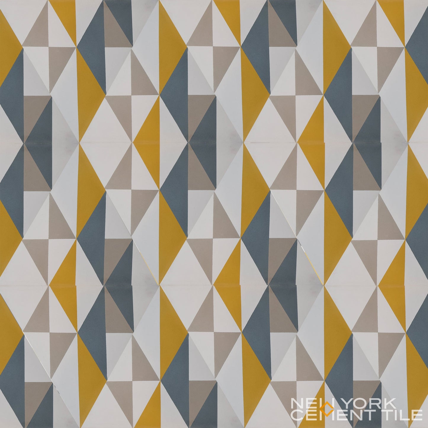 NLT-12A tile sample from New York Cement Tile: geometric pattern in yellow, gray, blue & white. Brand logo in corner.