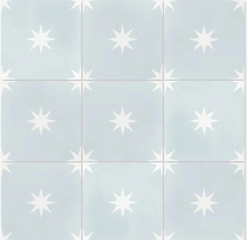 Nine Pleiades A In Powder Blue tiles by New York Cement Tile, in a 3x3 grid, feature white stars and handcrafted detail.