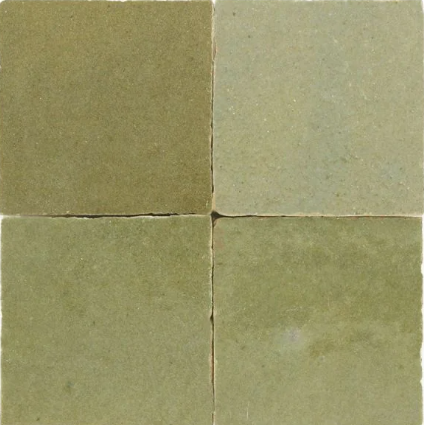 Four Olive Grove Zellige tiles by New York Cement Tile in a 2x2 grid, each with unique green shades and rough texture.