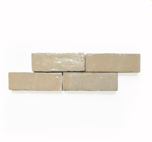 Four Terre Nue Glazed (2x6) tiles by New York Cement Tile, staggered on a white background.