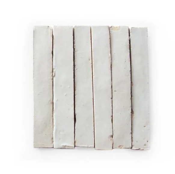 Six Slim Glazed Ivory Cloud (5½"x⅞") samples by New York Cement Tile are lined up vertically on a white background.