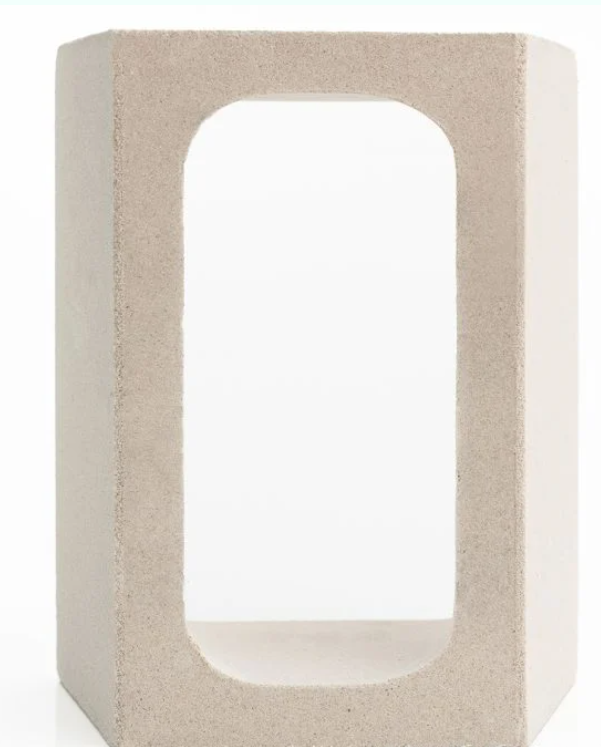 The GLAPA by New York Cement Tile is a light gray rectangular concrete block with a large rounded rectangular center opening.