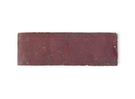 Rectangular piece of sandpaper on a white background