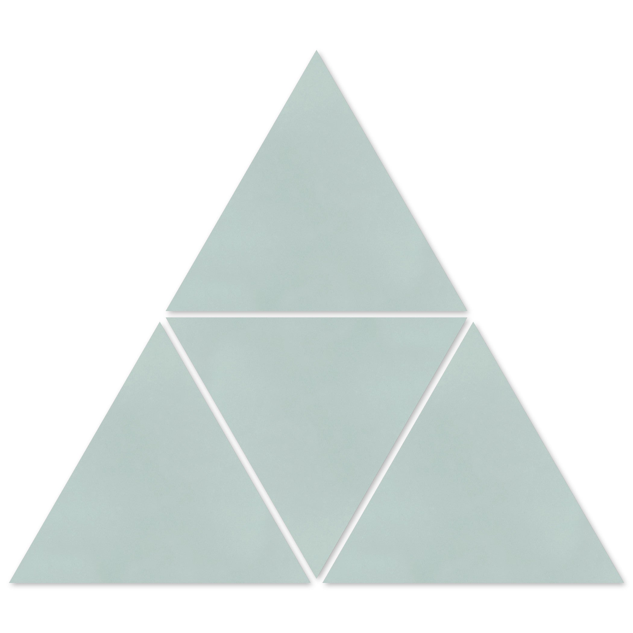 Four 4402-Solid Triangle tiles by New York Cement Tile create a bold blue geometric pattern with a central gap.