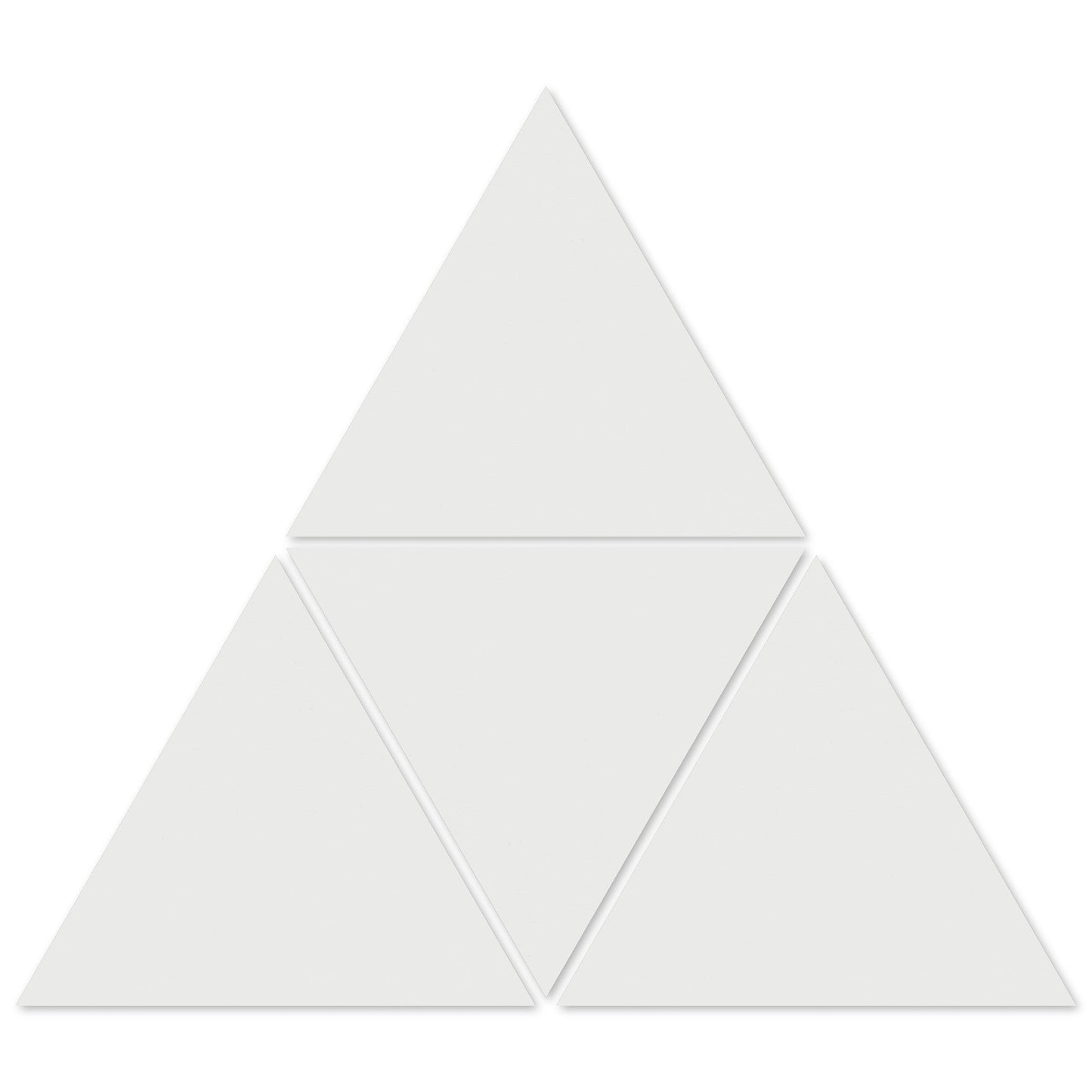 Four 1100-Solid White Triangle tiles from New York Cement Tile form a larger triangle with gaps—great for geometric designs.