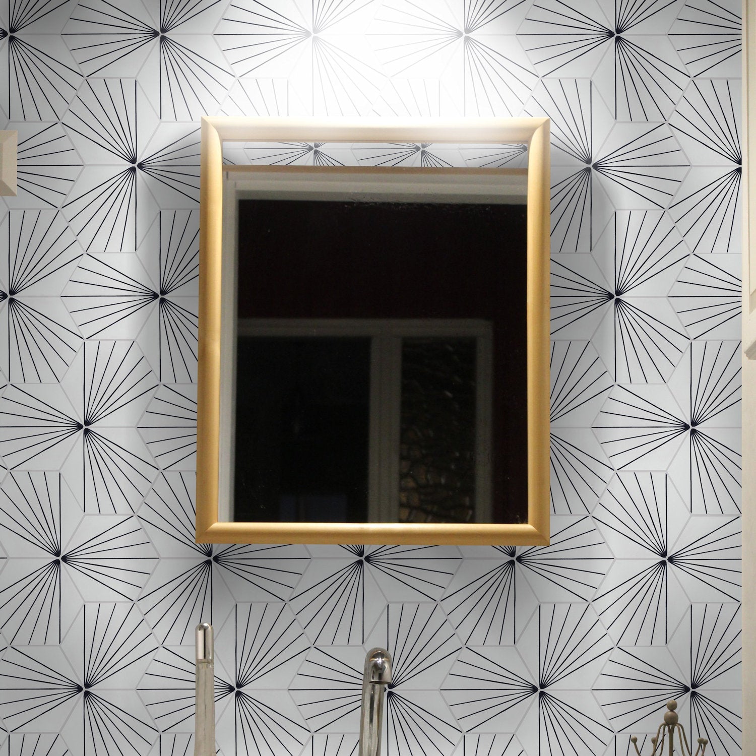 Gold-framed mirror on NH23-036 White hexagon tiles by New York Cement Tile, above a silver faucet.