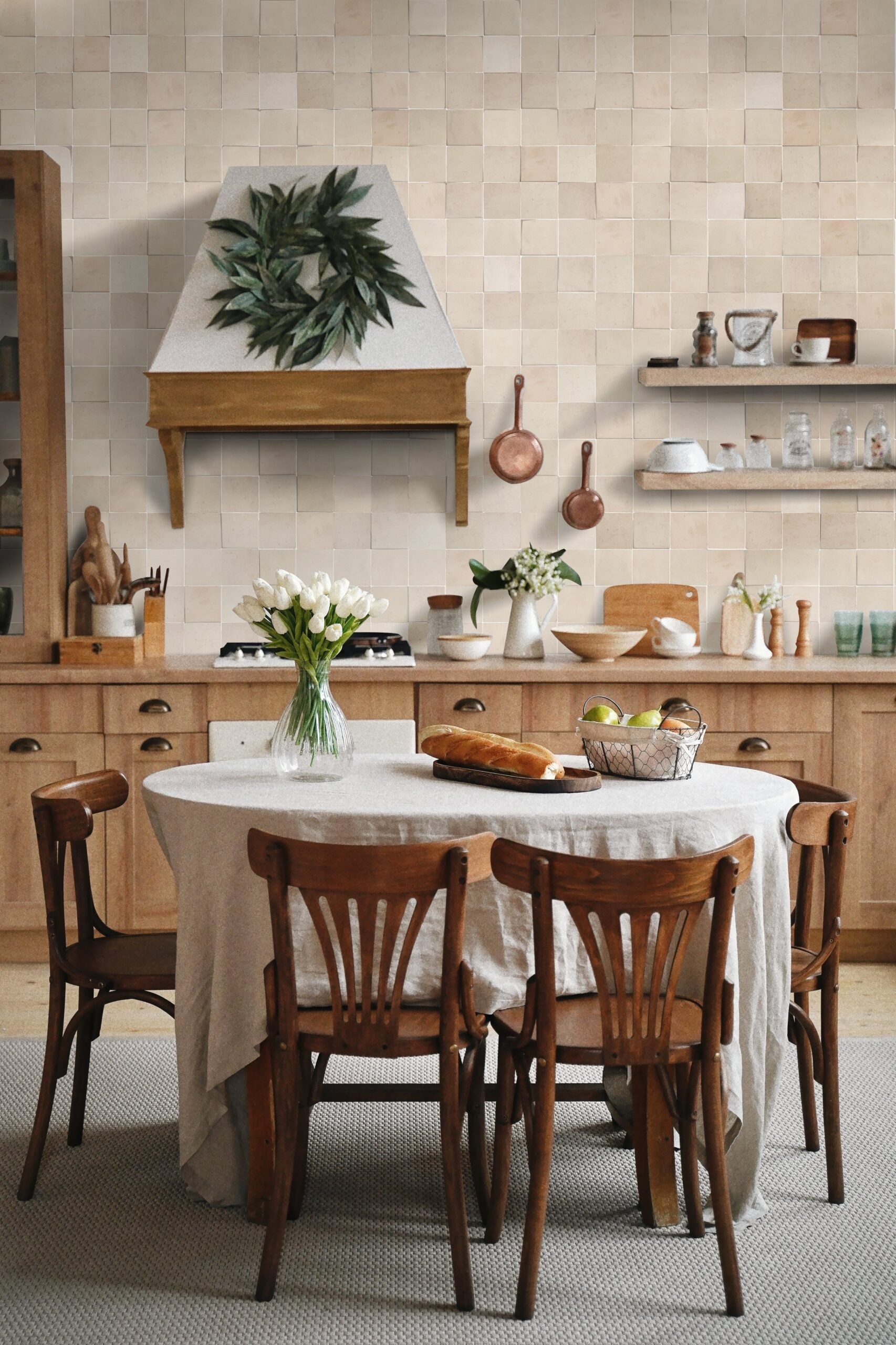 A cozy kitchen with Earthy Clay tiles by New York Cement Tile accents warm decor, wood cabinets, and a round table.