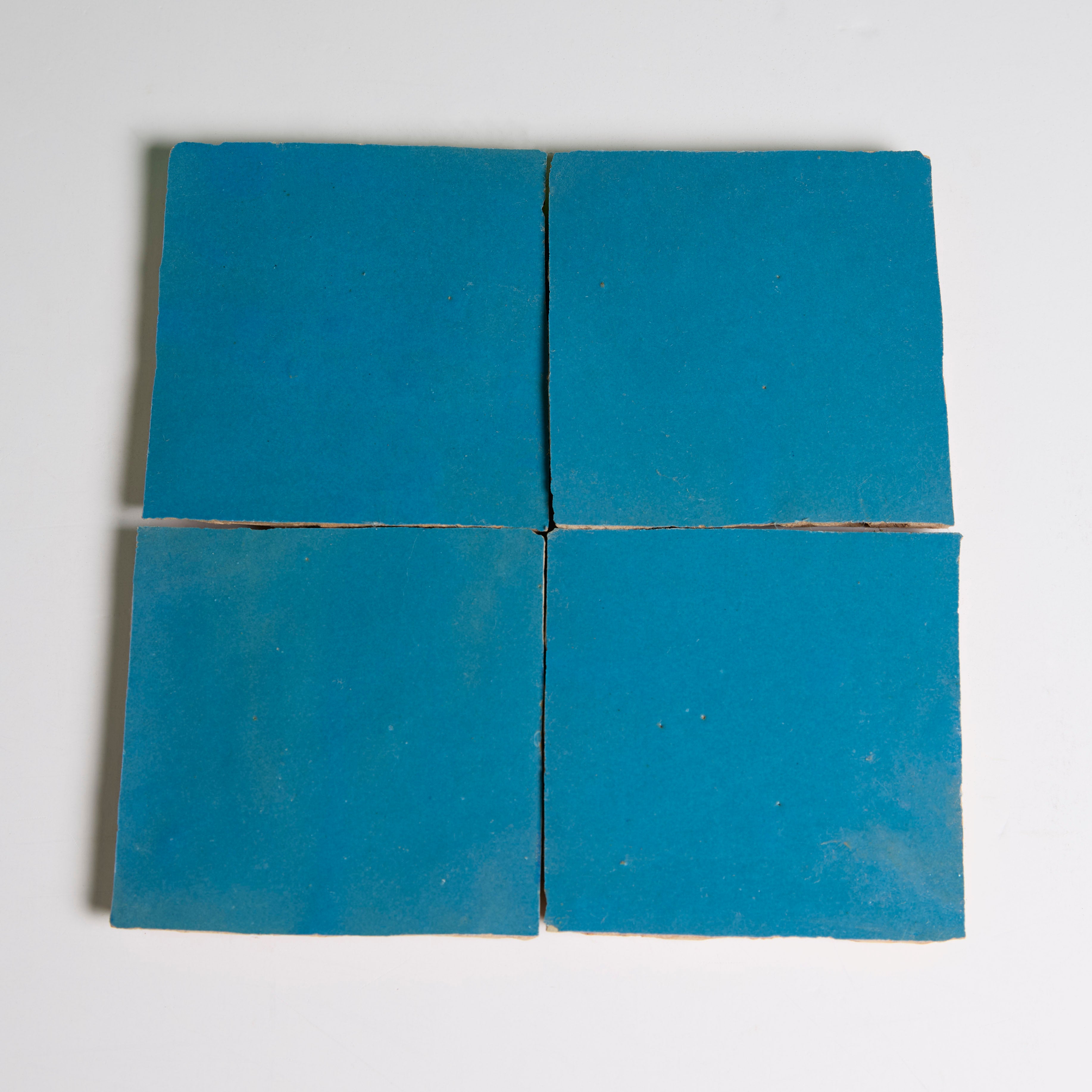 Four Azure tiles by New York Cement Tile in a 2x2 grid on a white background.