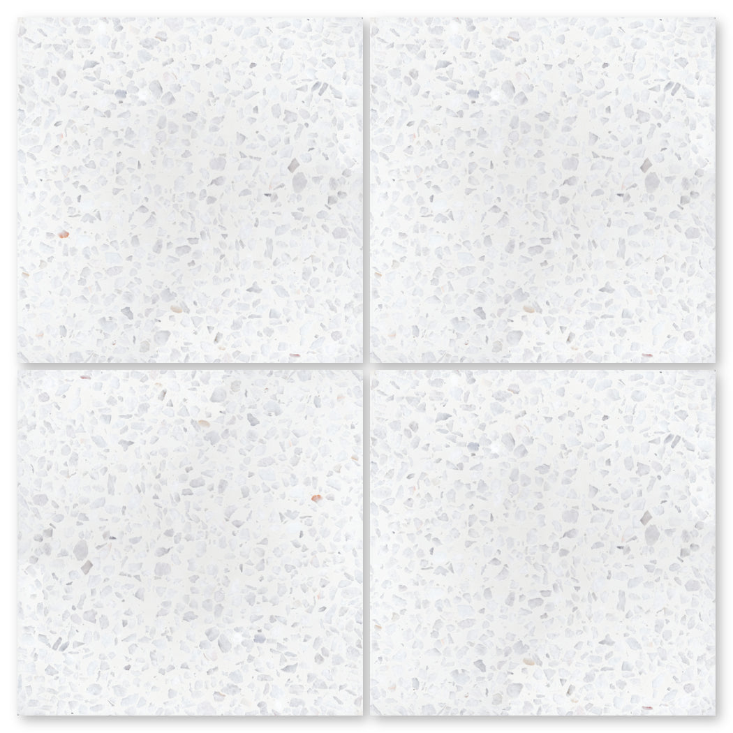 Four Terrazzo 12X12-NT30-Dew Drop tiles by New York Cement Tile, 2x2, for durable flooring with gray speckles.