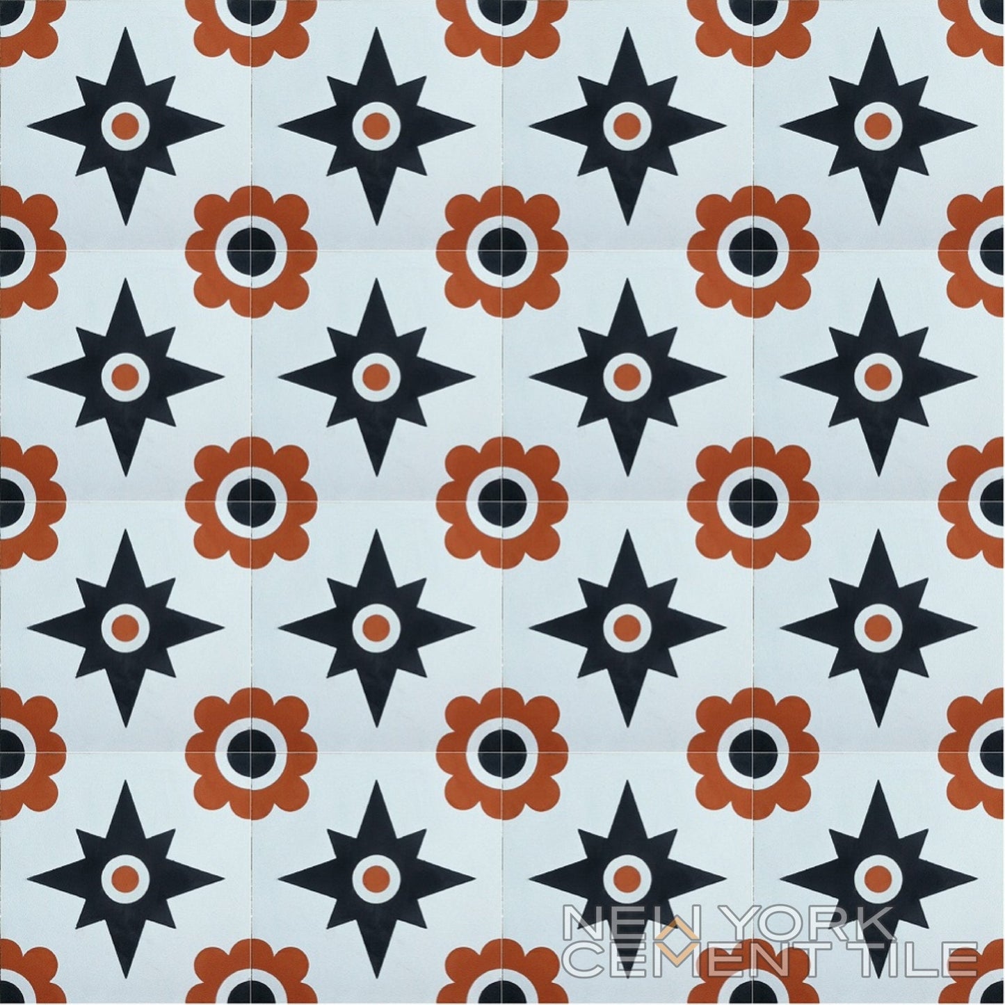 Repeating black stars and orange flowers on handcrafted cement tile, N20-153 Sample by New York Cement Tile.