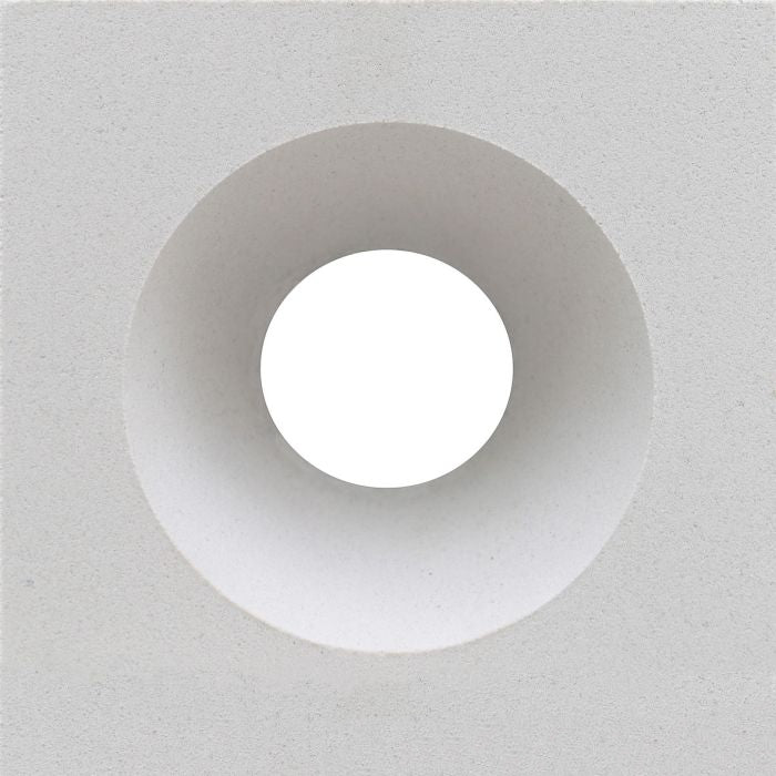 The Gada by New York Cement Tile is a white square mid-century concrete screen with a central circular tunnel-like opening.