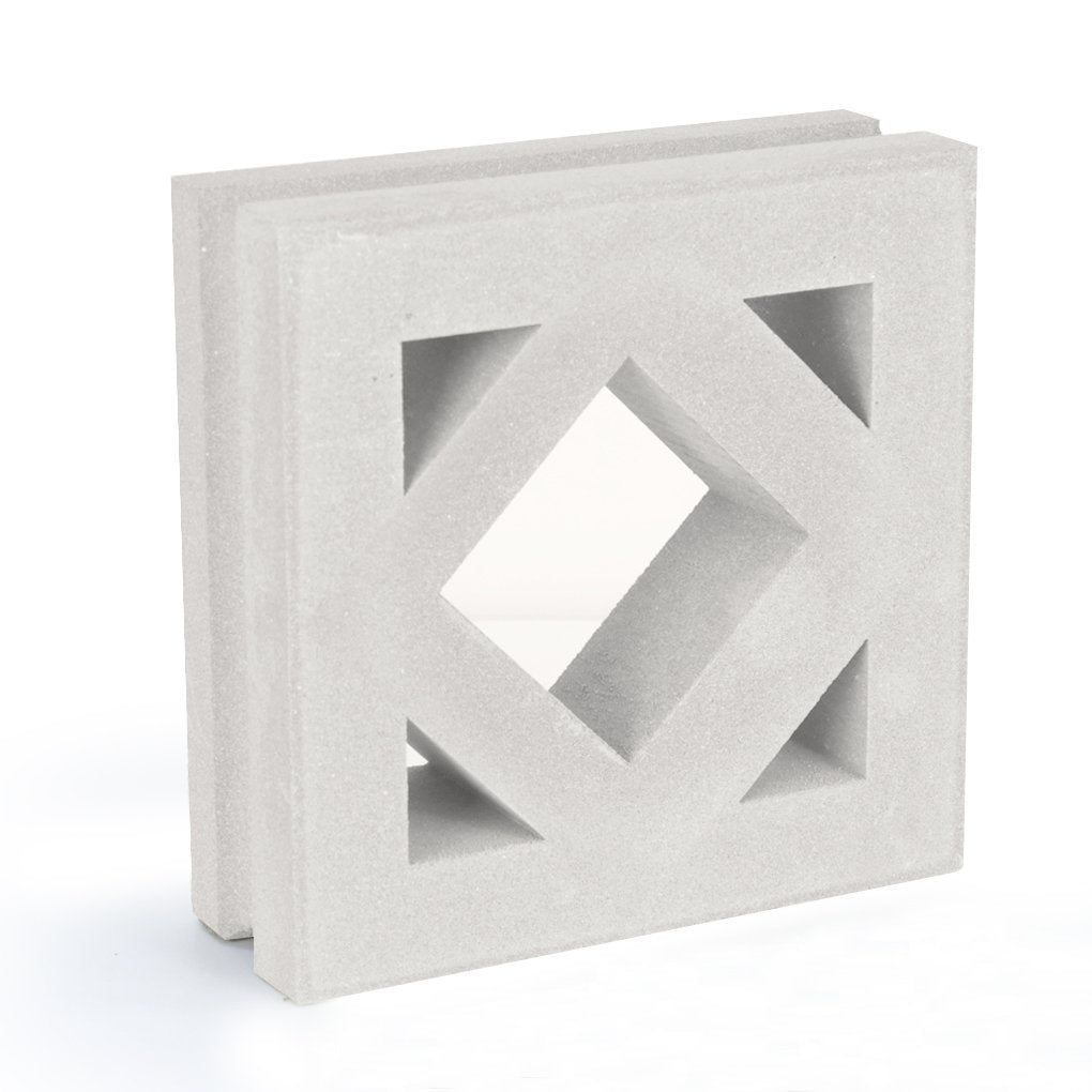 The Antil Sample by New York Cement Tile is a white, mid-century modern square block with a diamond center for privacy screens.