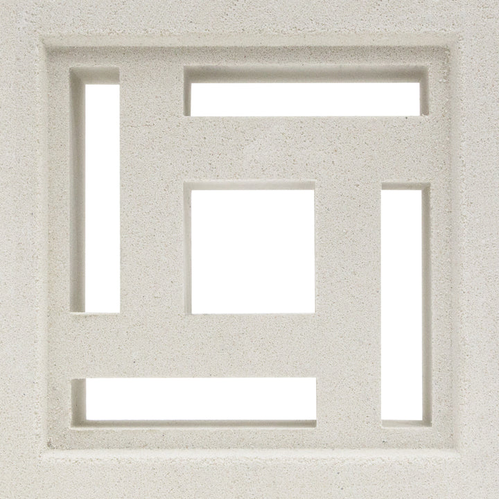The Carabado Sample by New York Cement Tile is a white square breeze block with geometric cutouts for modern privacy screens.