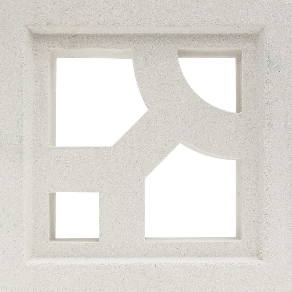 The Capri - NBB-008 Extra Sample by New York Cement Tile is a white block with geometric cutouts for stylish privacy screens.