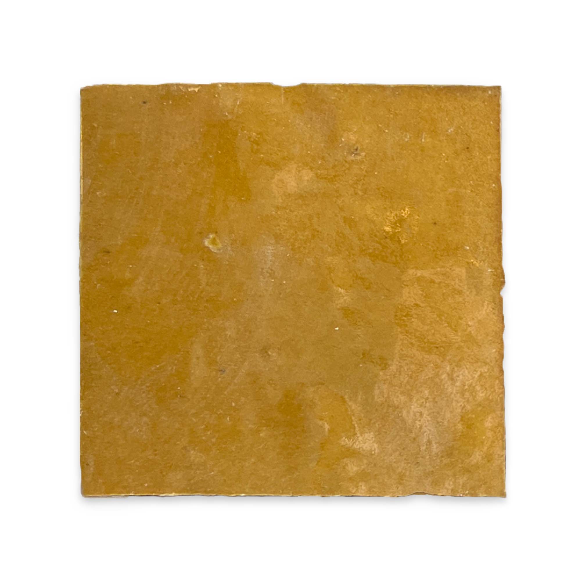 A square, flat cracker with a caramel glaze from New York Cement Tile, resembling natural clay tiles.