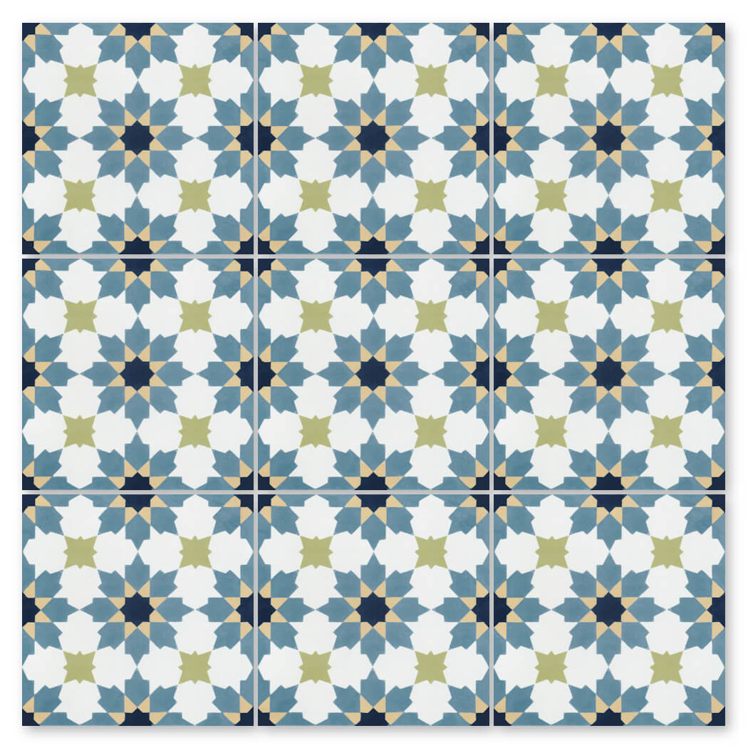 N20-028 Navy Blue by New York Cement Tile features blue, green, and white star and floral patterns inspired by handmade tiles.