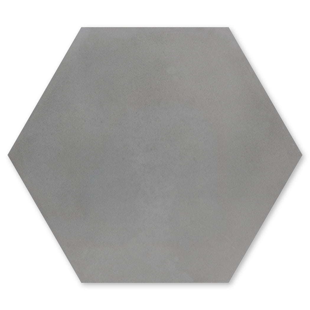 The New York Cement Tile Solid Hex-Mixed Grey Sample is a matte, solid gray hexagonal tile on a white background.