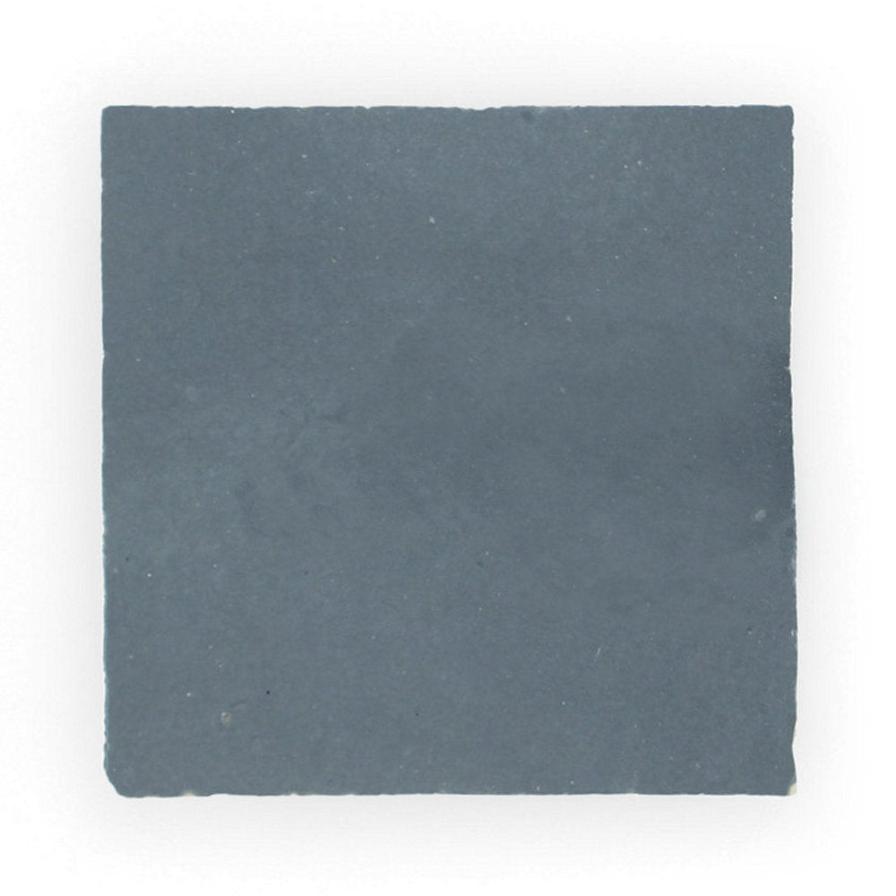 The Ash Grey Sample by New York Cement Tile is a handcrafted, square, matte dark gray tile with slightly uneven edges.