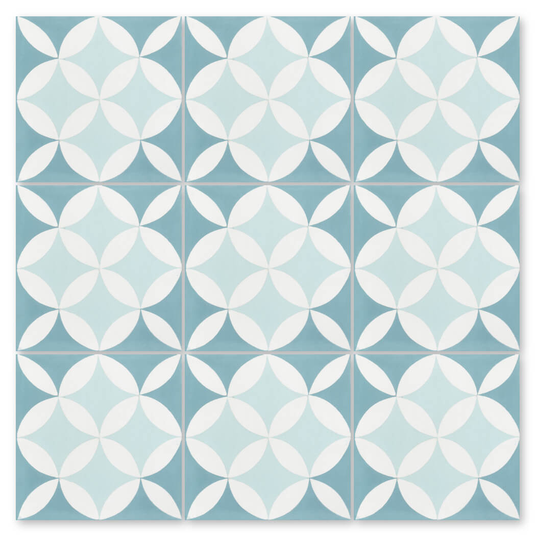 The N20-062 4400/2 tile by New York Cement Tile features blue and white petal designs for a handcrafted, durable floor.