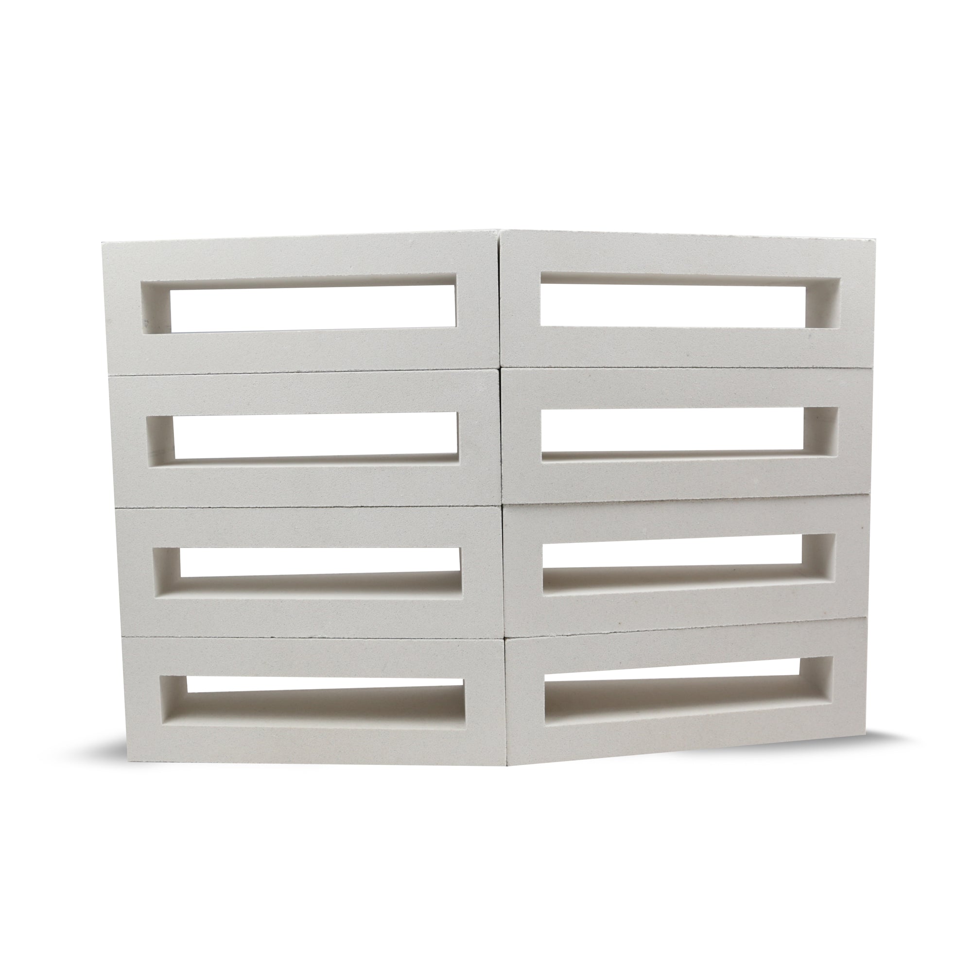 Eight Corsi Sample breeze blocks by New York Cement Tile, white and rectangular, stacked in two slightly bent columns.