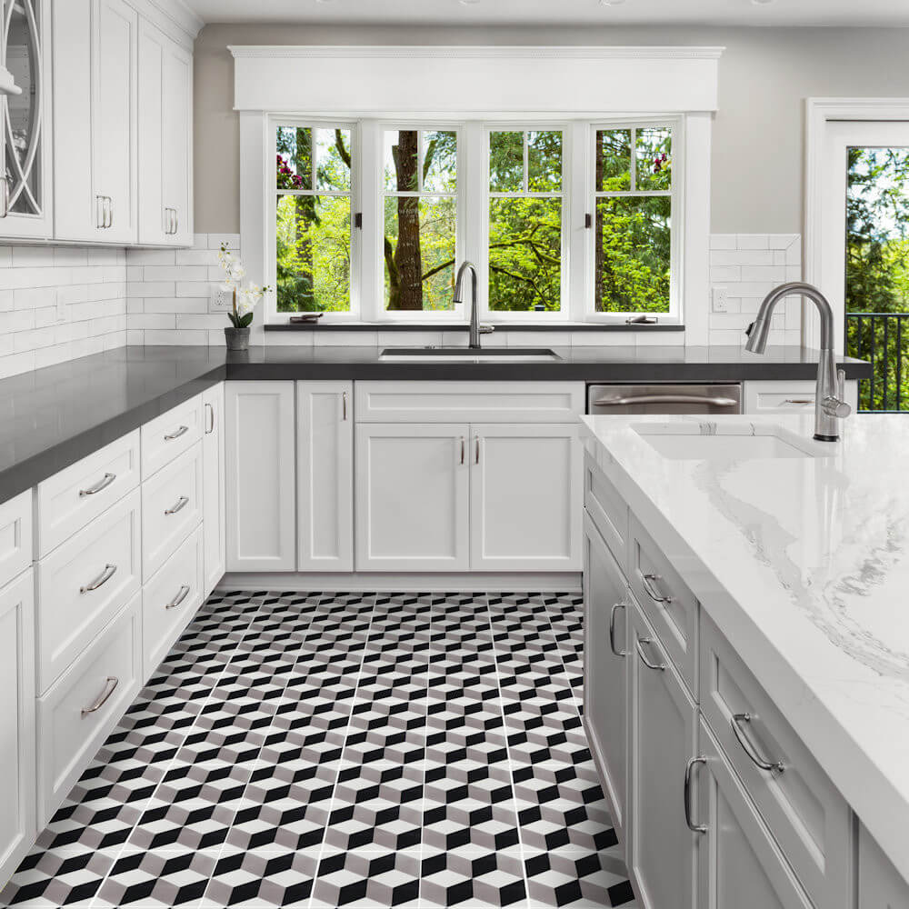 White kitchen with large windows, gray countertops, and N20-171 cement tiles by New York Cement Tile.