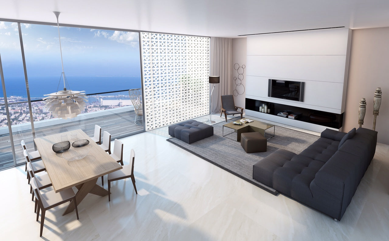 Modern living and dining room with Cura Sample by New York Cement Tile, city/ocean views, and floor-to-ceiling windows.