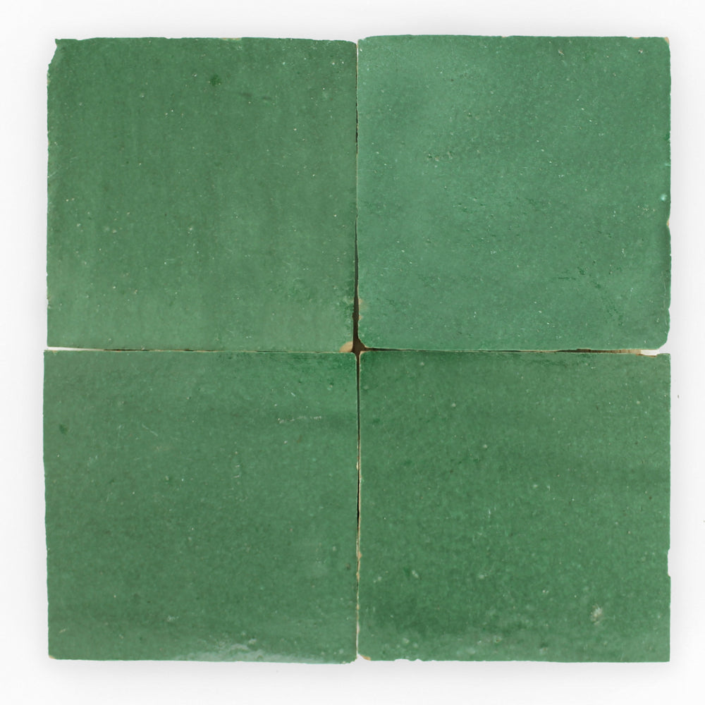 Four "Forest Green 2X2" tiles by New York Cement Tile in a grid, viewed from above on a white background.