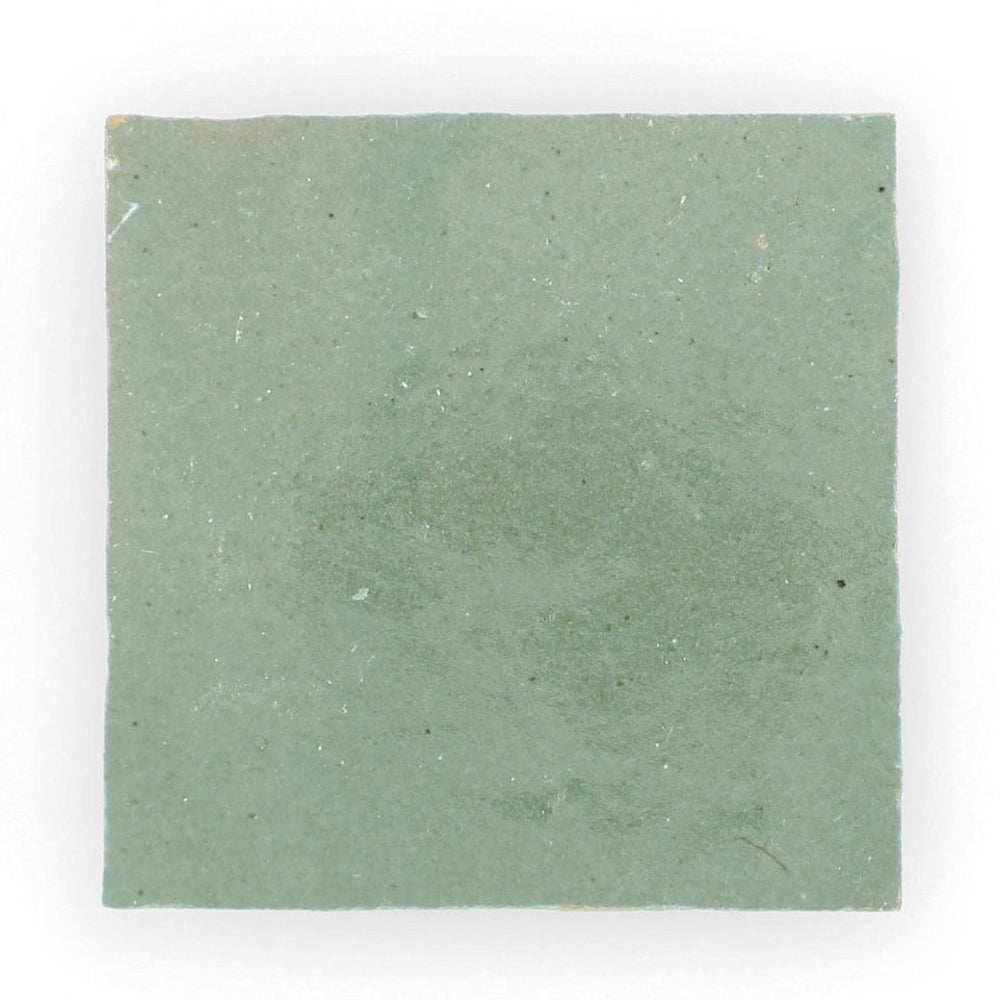 Leafy Green by New York Cement Tile: a square, matte, muted green tile with a handcrafted, subtly uneven surface.