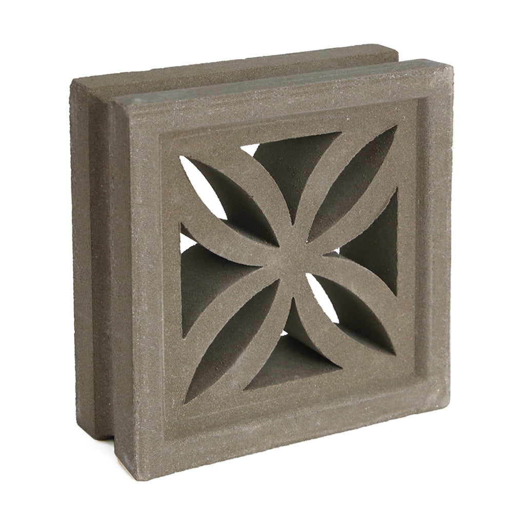 The Beeza Sample by New York Cement Tile is a square concrete breeze block with a geometric flower cutout for stylish partitions.