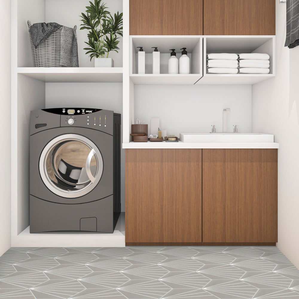 Modern laundry room featuring NH23-036 -G&W2219 Sample tile by New York Cement Tile, with wood cabinets and washer.