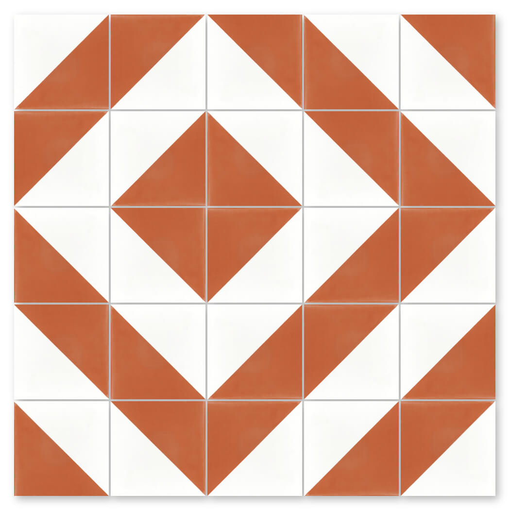 The N20-139 Terracotta & White tile by New York Cement Tile features orange and white geometric diamonds and chevrons.