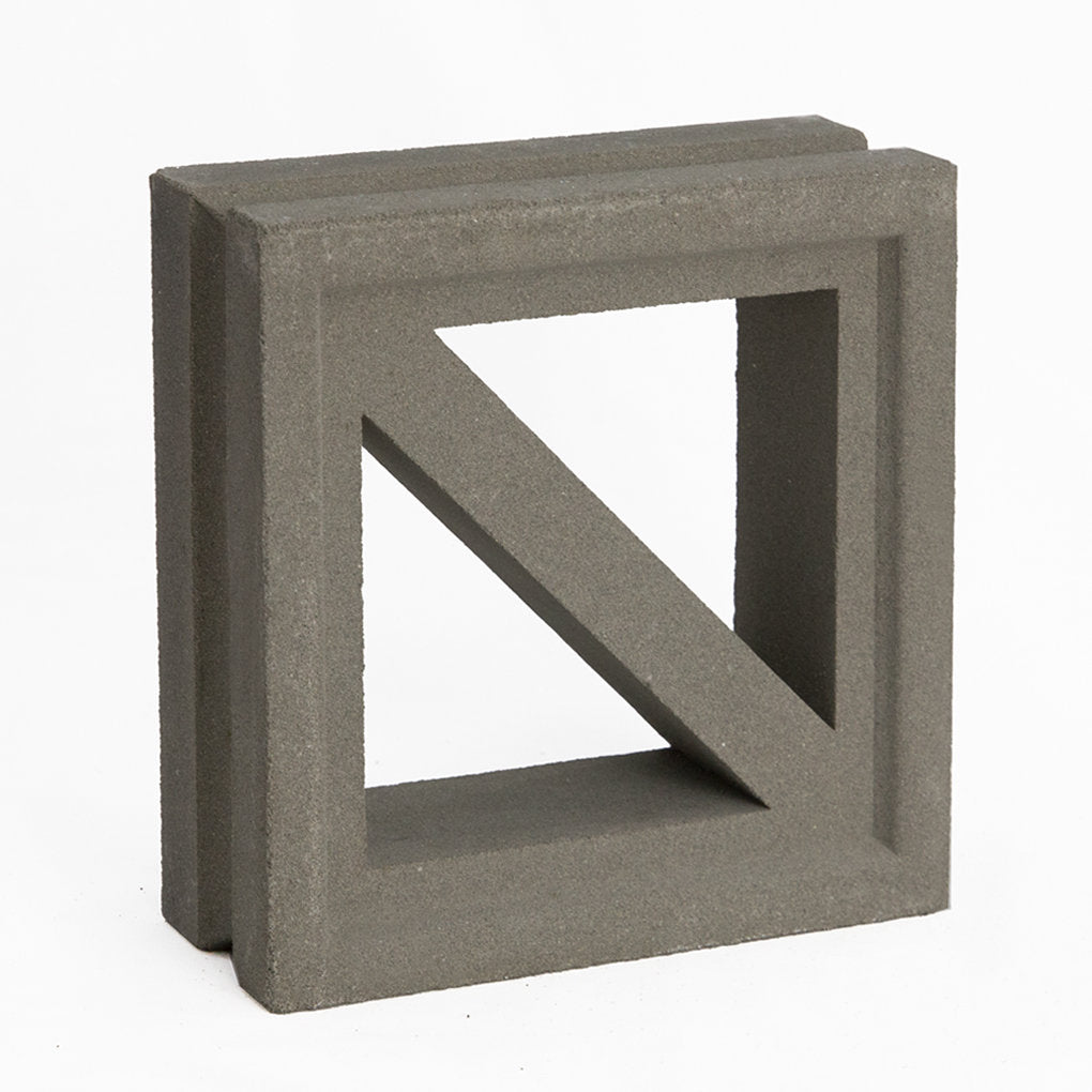 The Kaui by New York Cement Tile is a gray square concrete block, ideal for mid-century modern decorative partitions.