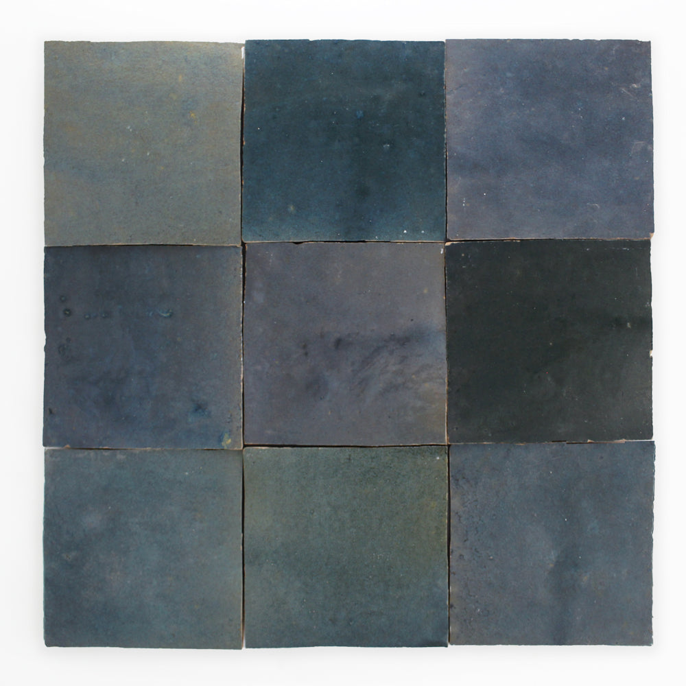 Nine Deep Teal tiles by New York Cement Tile arranged in a 3x3 grid, each with unique shade and texture variations.
