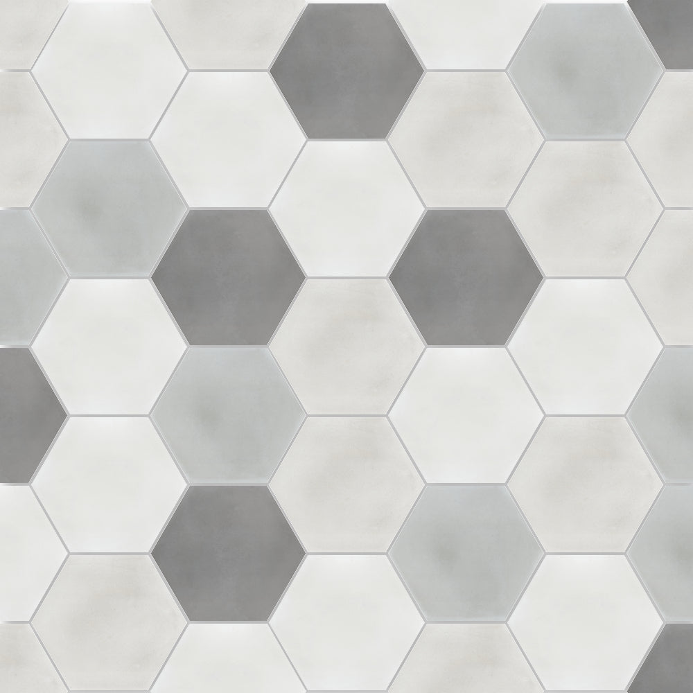 Solid Hex -Mixed Grey by New York Cement Tile offers a modern look with white and gray hexagon tiles in a repeating pattern.