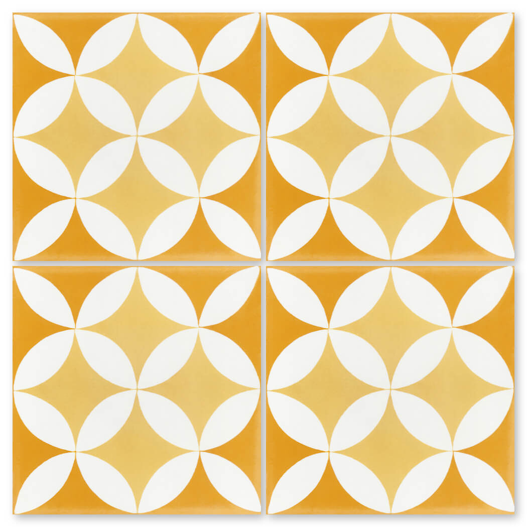 Four yellow N20-062 7704/10 tiles by New York Cement Tile create a white geometric, floral design on durable flooring.