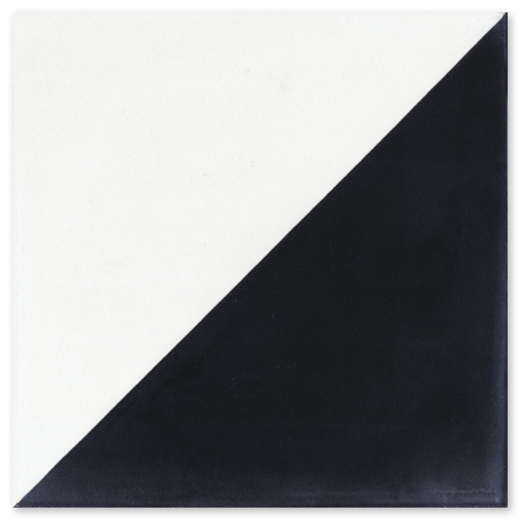 The N20-139 Black & White, Extra Sample from New York Cement Tile is a diagonally split black and white square tile.