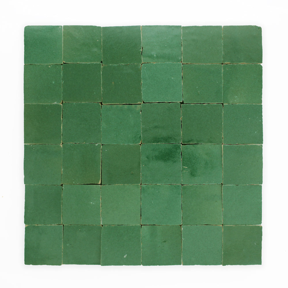 A grid of 36 Forest Green 2X2 tiles by New York Cement Tile arranged evenly on a white background.