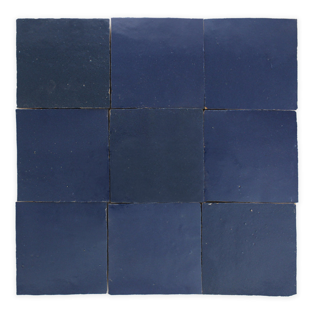 Nine Navy Depths sample tiles by New York Cement Tile are arranged in a 3x3 grid on a white background.
