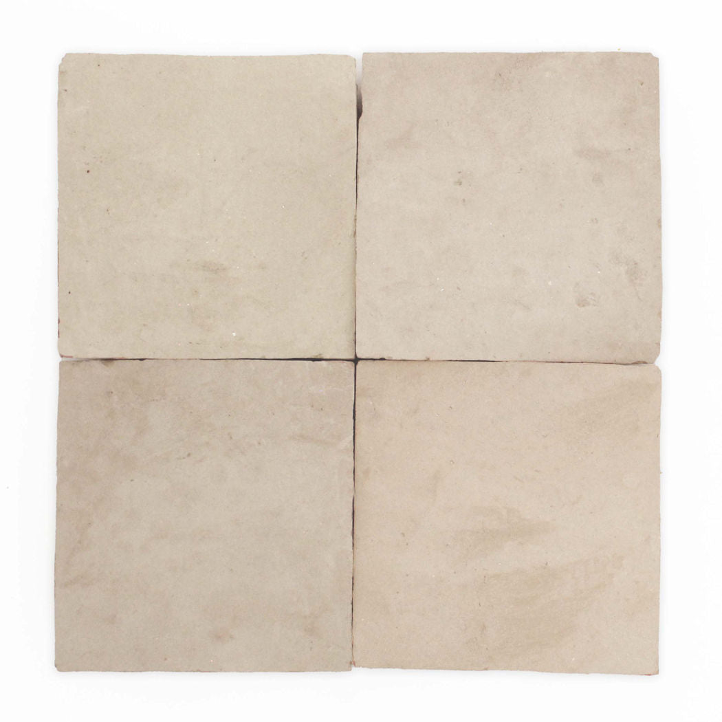 Four Earthy Clay 2X2 Extra Sample tiles by New York Cement Tile, light beige and handcrafted, in a 2x2 grid on white.