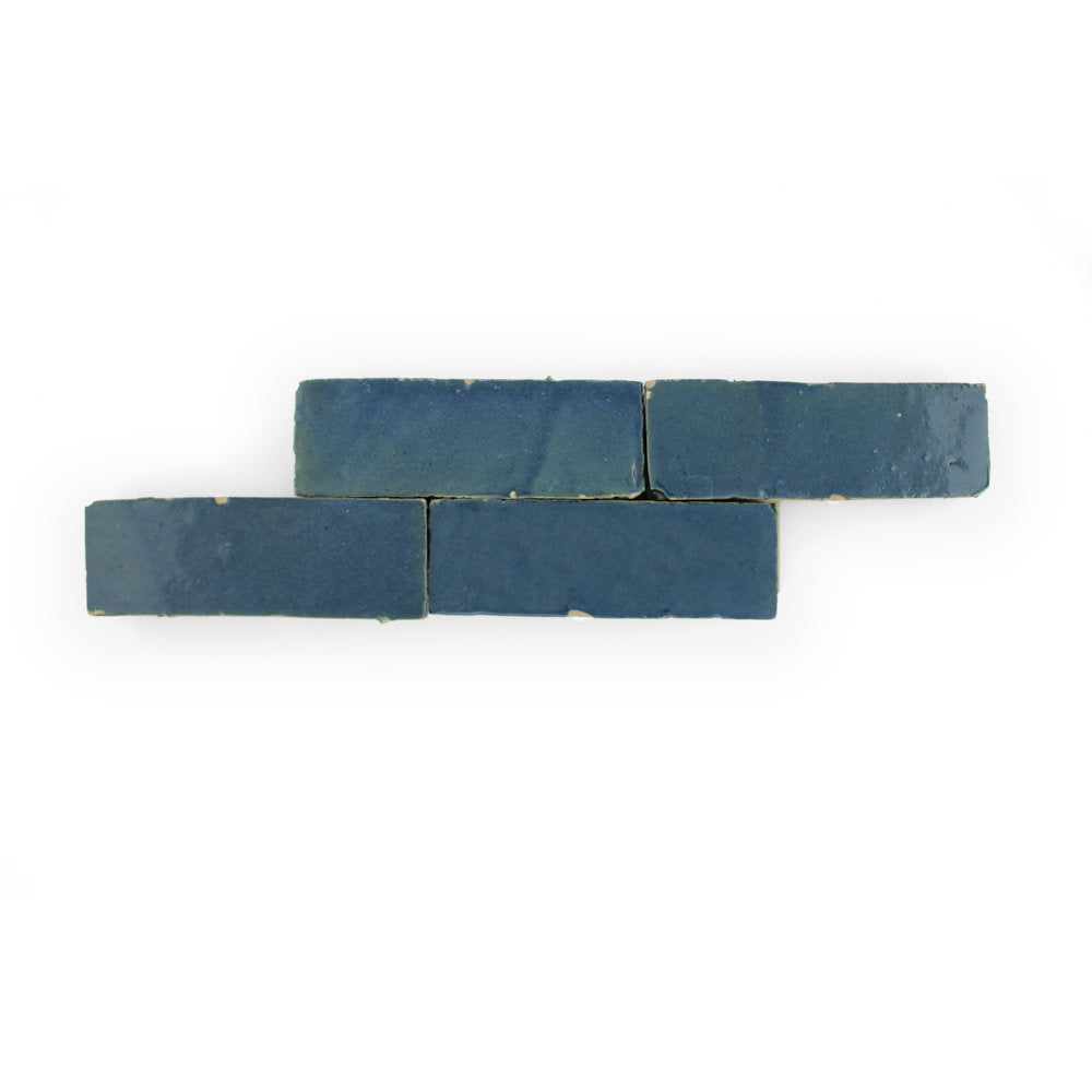 Four Sea Breeze (2x6) tiles by New York Cement Tile, perfect for a vibrant backsplash on a white background.